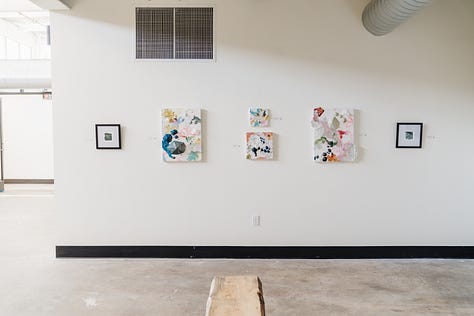 A series of images showing a brightly lit gallery interior with a concrete floor and high ceilings. Various people are gathered around podiums and a colorfully-painted park bench. It is inviting and spacious, with framed artworks on the walls, green broad leaf plants and a few easels displaying signage about the work. 