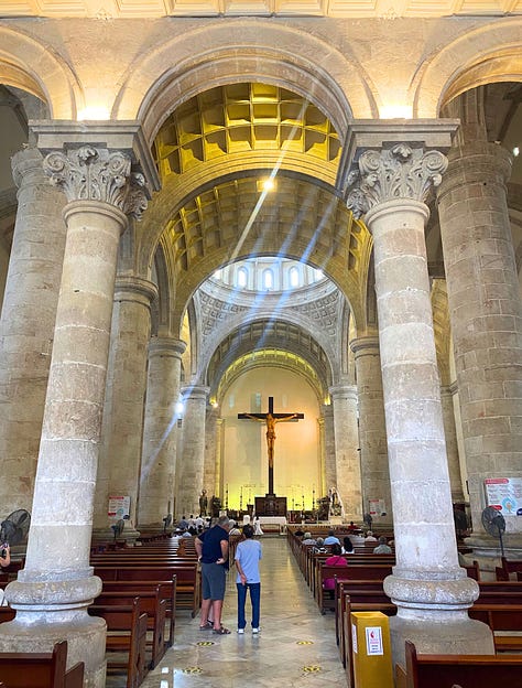 The cathedral's imposing exterior, a door knocker, cathedral interior, statue with pigeon, floor tile