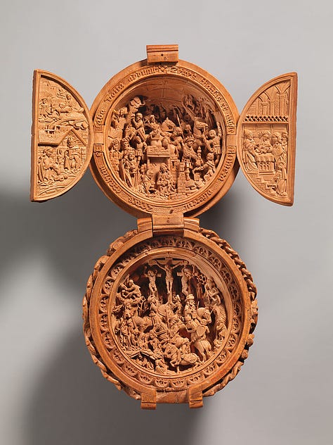 Intricately carved wooden sphere which opens to reveal scenes from the life of Jesus.
