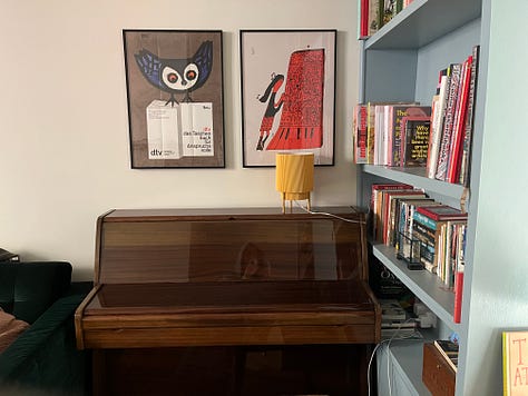 Photos of disorganised Artist book shelves and