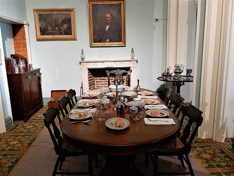 Collage of photos from the historic Arlington House, including photos of the massive columns with gravestones in the foreground, interior photos of the dining room and parlor, and a tomb marking the site of more than 2,000 unknown soldiers.