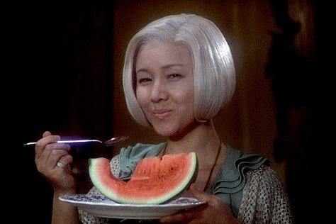 Shots from House (Hausu, 1977), including a witch cat eating a hamburger and watermelon