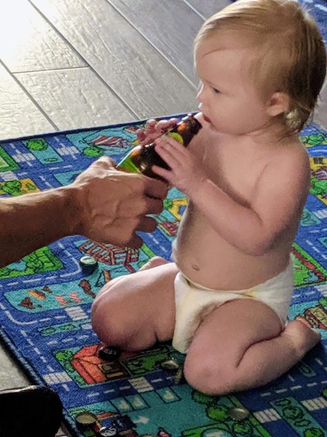 Officer Shawn Freeman of the Mesa Police Department was caught feeding a baby beer from a bottle labeled clearly as containing alcoholic beer, and he did so multiple times while smiling for photos.