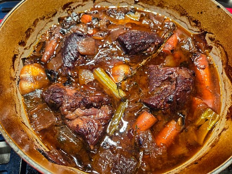 Left: seared short ribs in a dutch oven.  Center: short ribs with caramelized mirepoix, lemon zest, and garlic.  Right: braised short ribs with its braising liquid and vegetables.