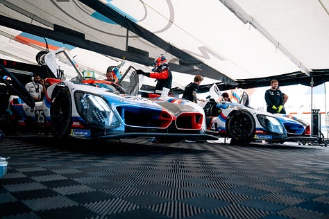 BMW M Team RLL crew members prep their cars and plan their attack ahead of the IMSA Monterey round at Laguna Seca in May 2025. Photos by Walter Fulbright.