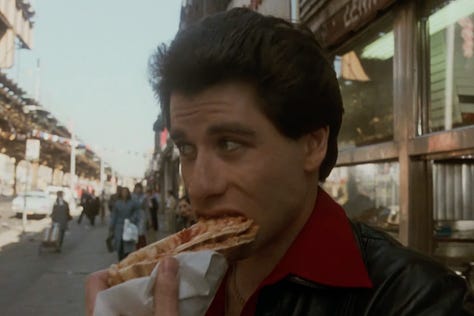 Double Decker Pizza Slices in Saturday Night Fever (1977) with John Travolta walking the streets of Brooklyn | Film Flavor: A Newsletter Surveying Food in Film