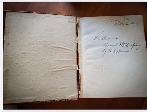 An old, ratty-spined notebook from 1884 containing lecture notes