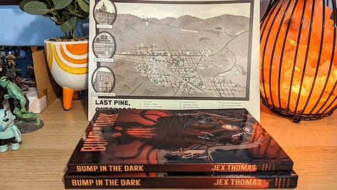 Photos of the print-on-demand version of the TTRPG Bump in the Dark.