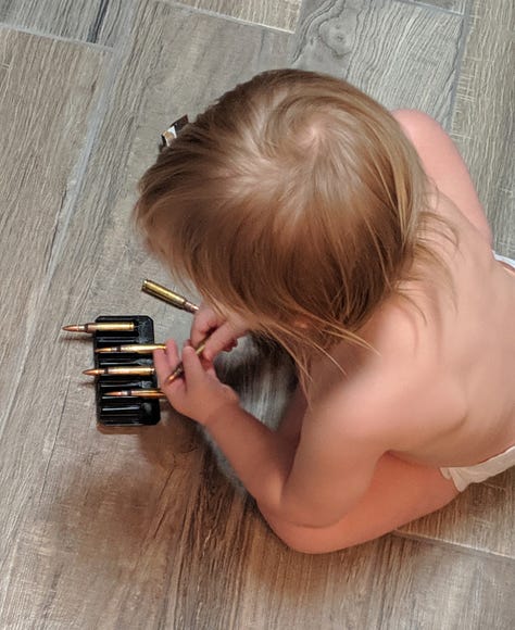 Shawn Freeman gives baby ammunition to play with while loaded firearms are within the child's reach. Mesa Police Officer Shawn Freeman irresponsible gun safety