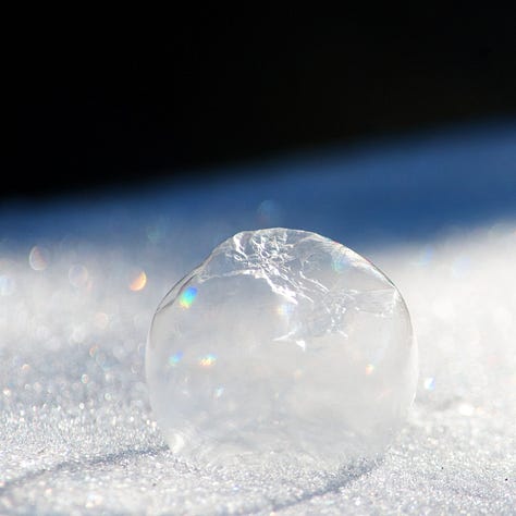 A series of three images shows a frozen bubble deflating and shattering.