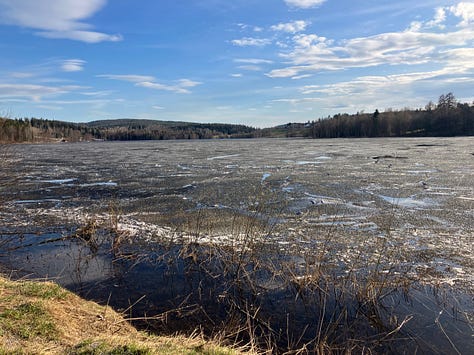 Sidsjön lake in Sundsvall shows ice, snow on the next-door hill and finally a lake clear of ice, two days later