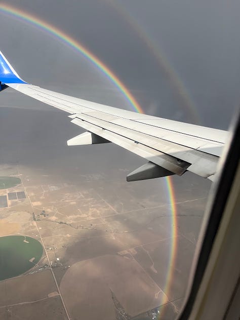 A full-circle double rainbow I saw flying home from California.