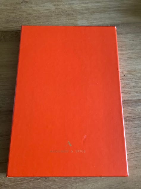 Orange notebook with velvet bag and box ready for writing poems into