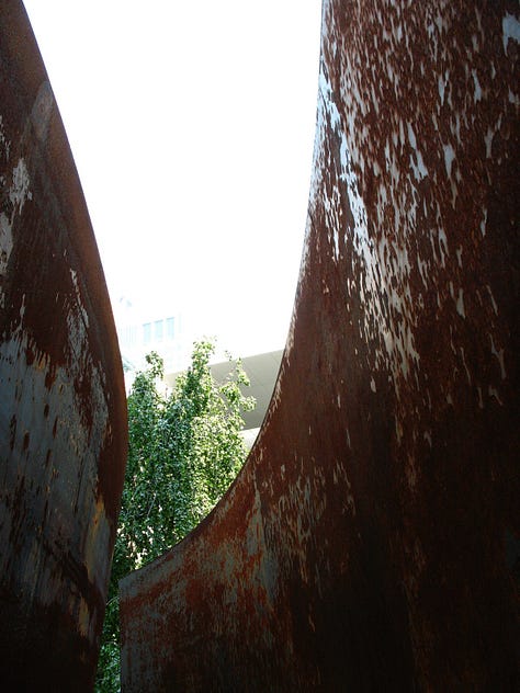 six images of Richard Serra's sculptures in the sculpture garden at the Museum of Modern Art in New York City, 2007