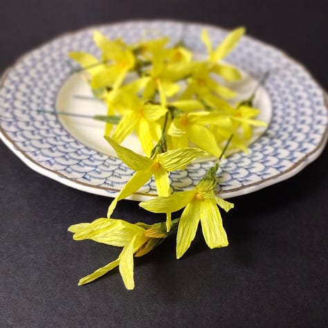 A series of paper flowers created in my classes this week: bright yellow forsythia, soft blue Iris and classic pink and cream roses
