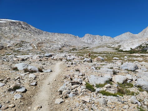 Tall granite mountains with paths leading to sights unknown