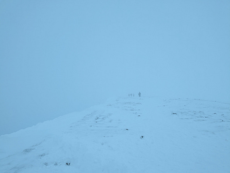 Sunset walk on Pen y Fan in winter with snow 