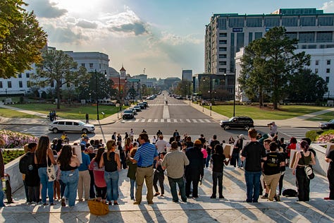 Citizens gather for a vigil to remember loved ones who have died in Alabama's prisons