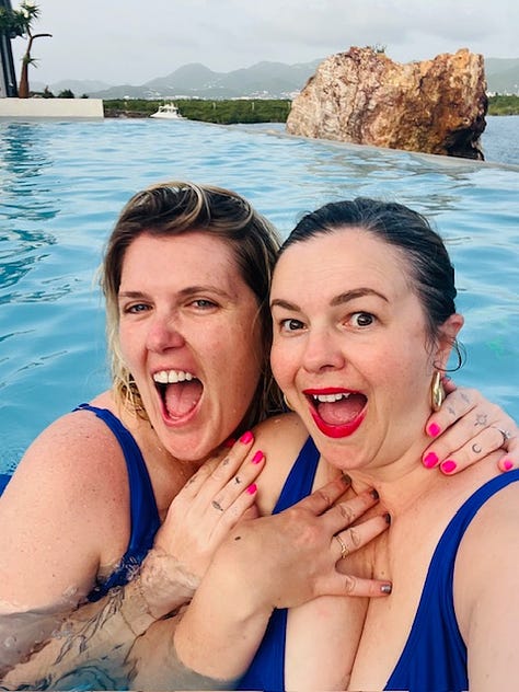 Three photos. From left to right: 1. Amber Tamblyn and Eliza Clark pose together in the pool for a selfie. They both look into the camera with slight, coy smiles. 2. Amber Tamblyn and Eliza Clark pose in the pool together for a selfie. Eliza has her arms around Amber. They both look at the camera with their mouths open, making surprised/excited faces. 3. Amber Tamblyn takes a selfie of her and Eliza Clark in the pool. Eliza is behind Amber making a kissy face with pursed lips. Amber is laughing.