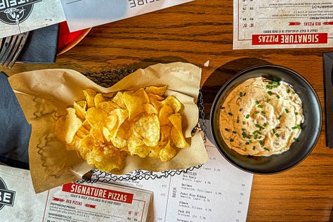 Pitfire Pizza’s legendary Garlic Knots, Spinach and Artichoke dip with chips and the whipped feta with caramelised onions