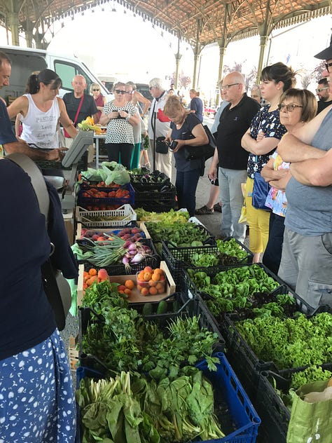 Images of a weekly Italian market, with lots of fresh produce and life