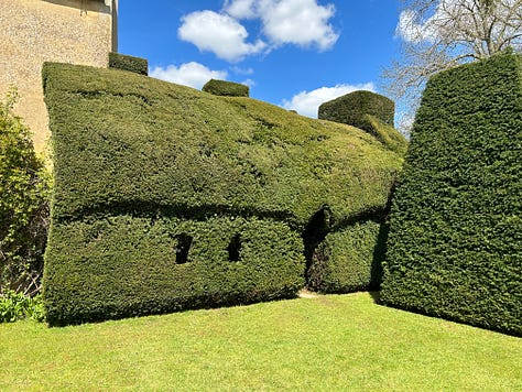 Westwood Manor, Bradford on Avon, Wiltshire. A topiary house leads to the garden and two ponds.