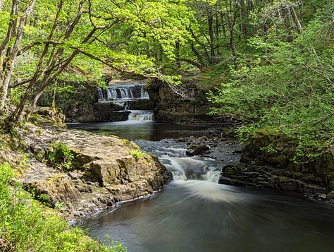 images of waterfalls in sunshine in the brecon beacons