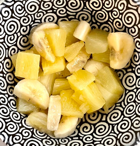 a green bottle of Mountain Dew with yellow boxes of Jello lemon gelatin and lemon pudding mixes, and sliced banana with pineapple chunks