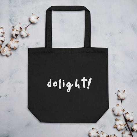 hat, mug, and tote with the caption "delight!"