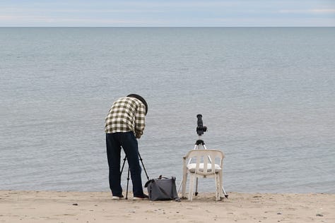 Photo of John Charlton waiting for clouds to clear by Ron Waddling