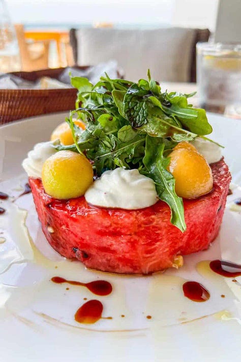 A representative sample of the food available at The Chedi Muscat including watermelon salads, grilled local fish and quinoa salads from the Pool Cabana.