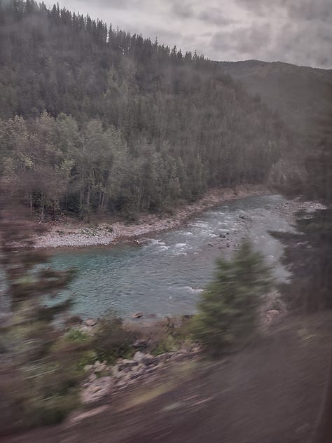 The first image shows a mountain gully with a river running through it. The second is a sunset over a large lake. The third shows another river with a rocky bank on one side and coniferous forest on the other