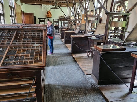 Photo 1: Aisling in the printing room, the printing presses are visible to the right. Photo 2: an image engraved on copper plate with the ink imprint of the image displayed in a book to the right. Photo 3: an imprint of a skeleton looking fed up. 