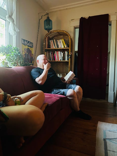 Photo 1: A group of poets/friends on a terrace in Old Montreal. Photo 2: A flier of Kirby's reading for She on a screen door in Kingston ON  Photo 3: Kirby reading in a living room.