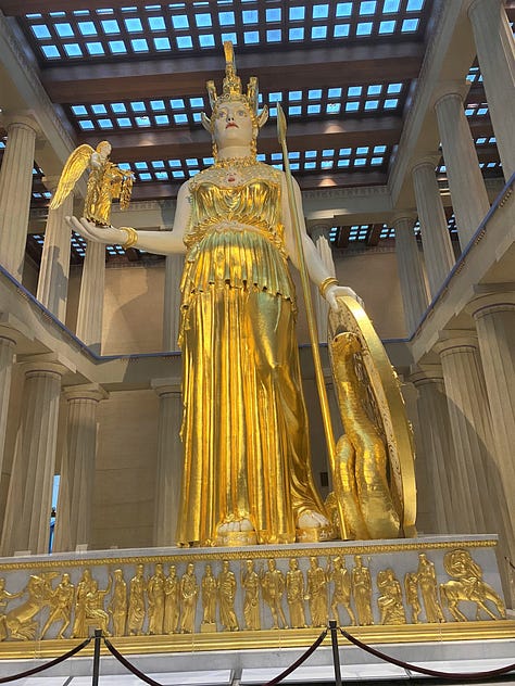 Giant statue of Athena at the Nashville Parthenon along with the recreation of her temple