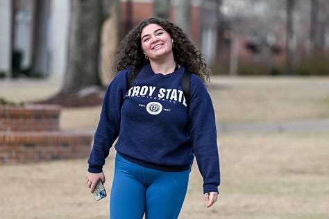 Students walk across the Troy campus heading to class