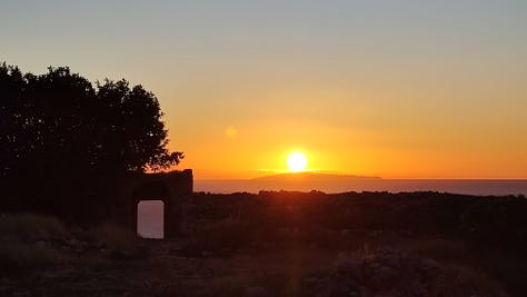mountain sunrise, sea and compass