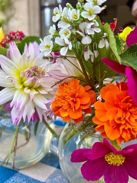 Colorful flowers, a tarte au soleil appetizer with pesto, and lunch on a pretty terrace