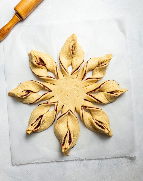 Making cranberry orange star bread.