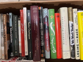 A selection of books in nine images. Each image has several books all lined up together in a row. One is a top-down look at four books that features their covers instead of their spines. Titles include:  W.E.B. Du Bois' "The Philadelphia Negro," "Between Past and Future" and "Human Condition" by Hannah Arendt, "Middle Passages: African American Journeys to Africa," 1787-2005," Michael Eric Dyson's "Holler If You Hear Me," and "City Schools and the American Dream: Reclaiming the Promise of Public Education" by Pedro A. Noguera and James A. Banks