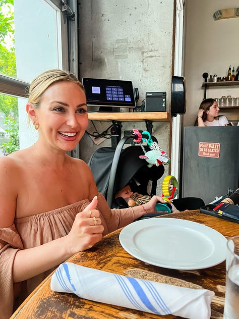 Photo of a woman at a restaurant dining table laughing and entertaining her baby in his stroller beside her; photo of woman sitting at restaurant dining table carrying her baby boy in her lap as he faces the camera; photo of woman carrying her friend's baby boy in her lap and smiling sitting at a restaurant dining table