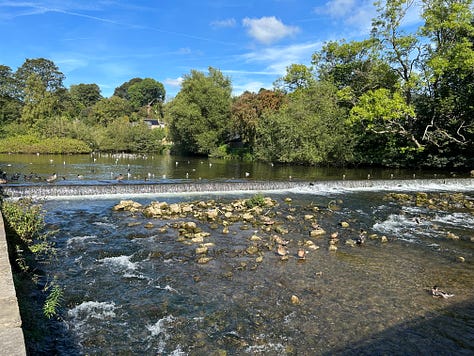 3 photos. 1 The 17th century stone bridge crossing the Rover Wye. Picture 2 the river flowing over a small weir. Picture 3 Trout swimming in the River Wye close to the river bank with ducks swimming above. Images: Roland's Travels