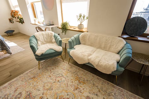 white blankets over blue chairs in waiting areas in a wellness studio