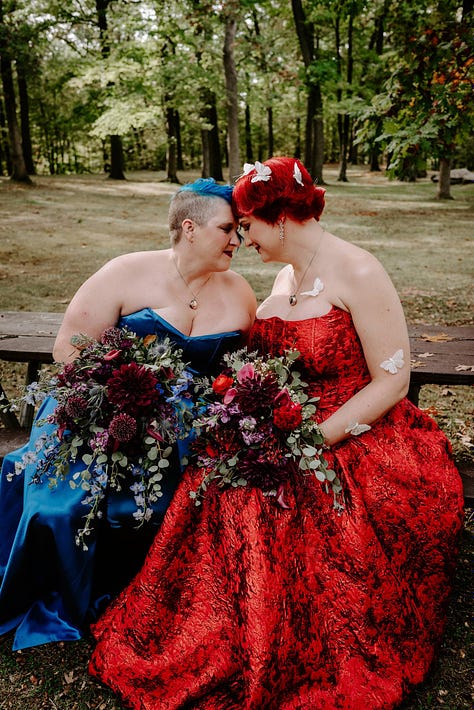 Three poctures of Doc impossible and B--, her wife. B-- wears a blue corset with an overskirt, and Doc is in a floor-length red zilk brocade strapless dress.