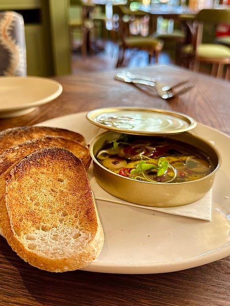 tin of anchovies and sourdough, crab and sweetcorn bites, grilled prawns on black beans.