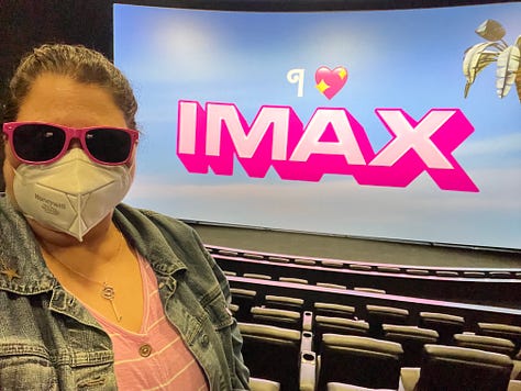 Photos of a girl dressed in pink at the movies seeing Barbie in IMAX