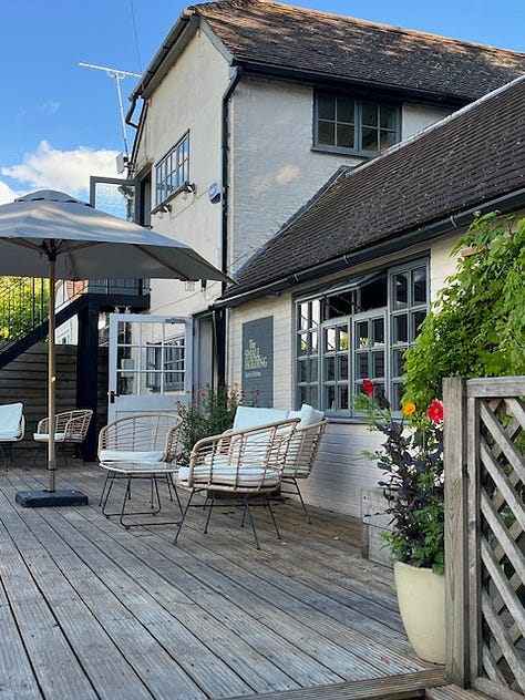 Nine images showing the outside seating area of The Small Holding with images of crops growing in the vegetable garden