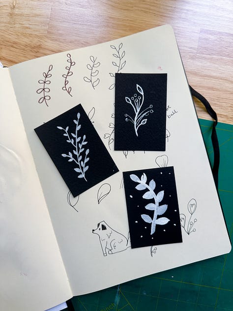 sketchbook pages with Botanical line drawing, witchy vase taxonomy drawings, and cute cottages lineart