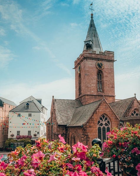 The picturesque capital city of Guernsey, St Peter Port: entrance, the city church, the colorful streets shrouded in mist. Photos by Peter Tiffin