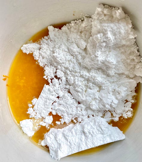 a bowl with batter and orange zest, then with a mixed very thick batter, and last powdered sugar and orange juice to mix for a glaze